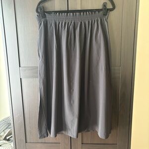 Athleta Black High-Waisted Pull-On Midi Skirt with Pockets